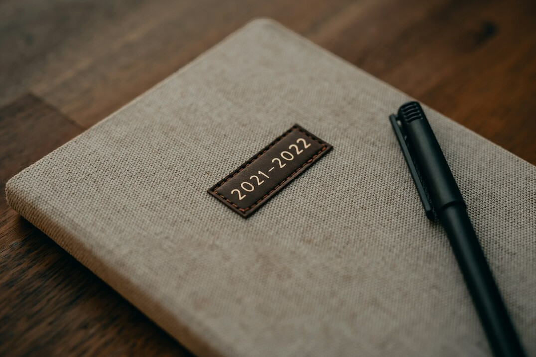 writer at desk with notebook